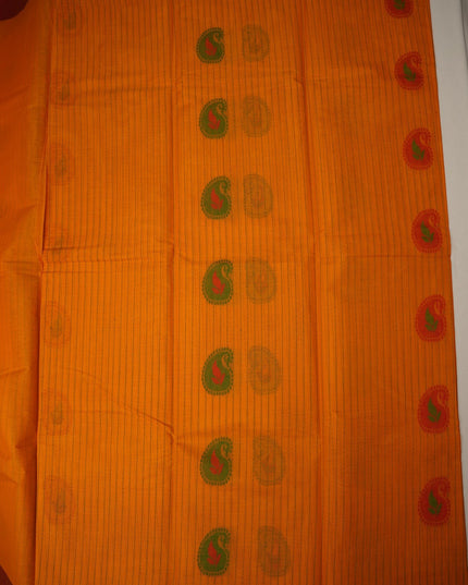Bhavana Handlooms peach orange handloom saree featuring traditional green paisley motifs and a contrast maroon border.