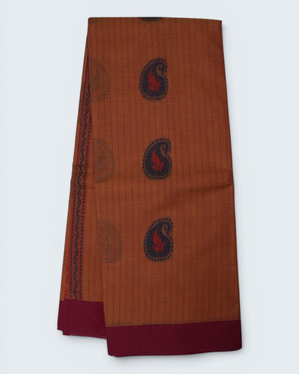 Bhavana Handlooms peach orange Coimbatore handloom saree with navy blue paisley motifs and a contrast rani pink border