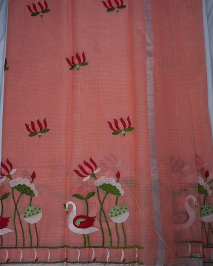 Bhavana Handlooms peach pink silk Kota saree featuring intricate swan and lotus embroidery and a silver border.