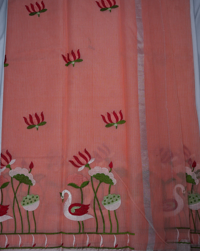 Bhavana Handlooms peach pink silk Kota saree featuring intricate swan and lotus embroidery and a silver border.