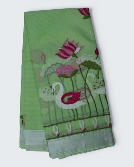 Bhavana Handlooms pista green silk kota saree featuring intricate swan and lotus embroidery and a delicate border.