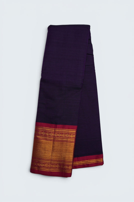 Bhavana Handlooms deep royal purple mercerized cotton saree with gold border and red trim. Lightweight, soft finish.