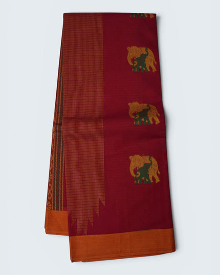 Bhavana Handlooms Coimbatore handloom saree in rani pink with gold and green elephant motifs and peach orange border.