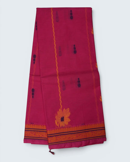Bhavana Handlooms Rani Pink Coimbatore handloom saree featuring traditional floral butta motifs and a woven border.