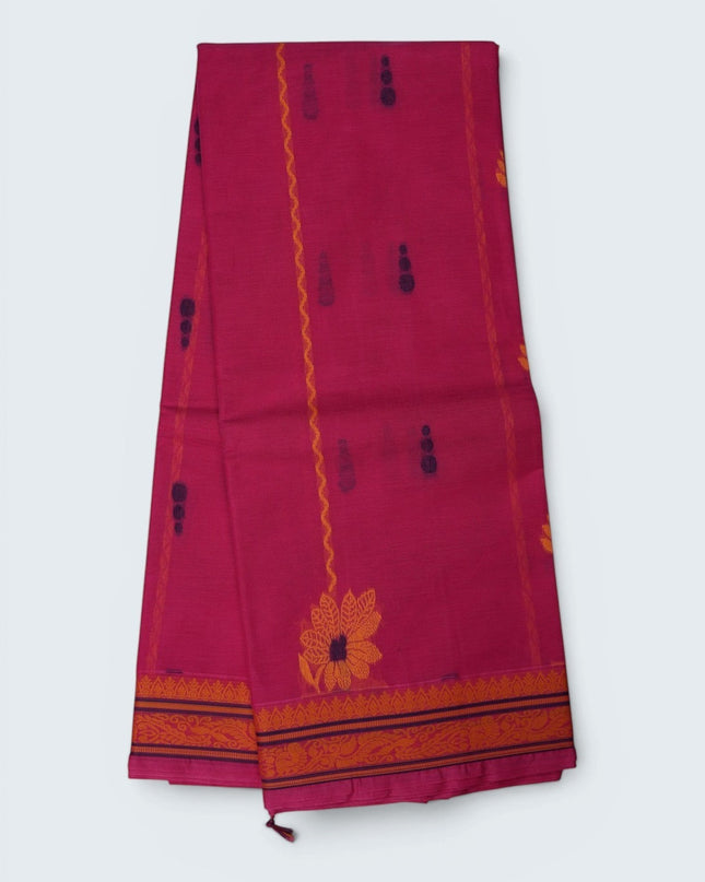 Bhavana Handlooms Rani Pink Coimbatore handloom saree featuring traditional floral butta motifs and a woven border.