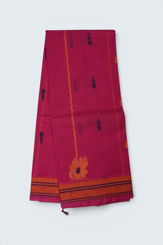 Bhavana Handlooms Rani Pink Coimbatore handloom saree featuring traditional floral butta motifs and a woven border.