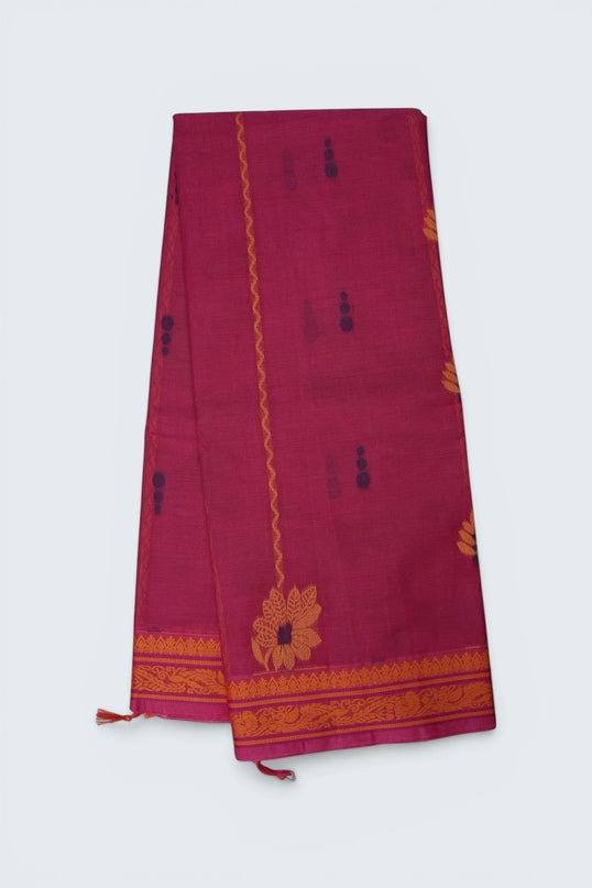 Bhavana Handlooms Coimbatore handloom saree in rani pink with traditional orange floral butta motifs and woven border