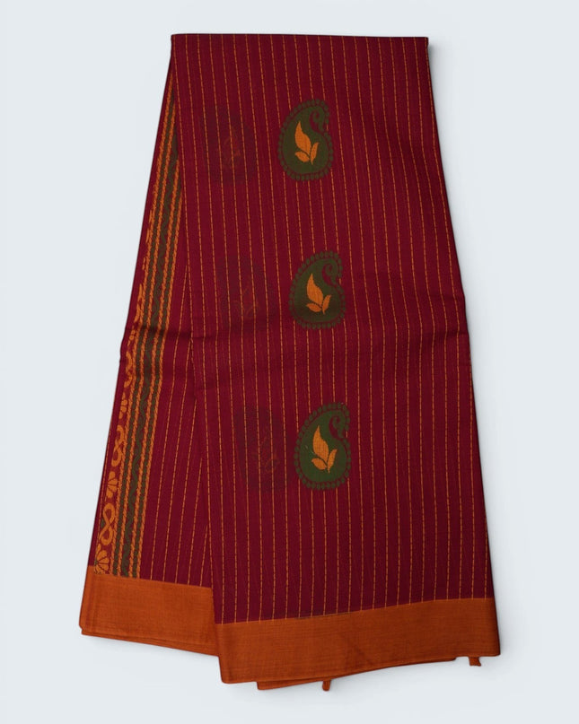 Bhavana Handlooms rani pink Coimbatore handloom saree with vertical stripes, paisley motifs, and peach orange border.