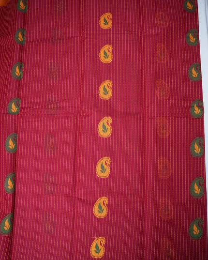 Bhavana Handlooms rani pink handloom saree featuring vertical stripes, paisley motifs, and a peach orange border.