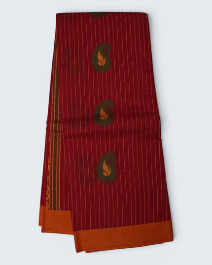 Bhavana Handlooms tomato red Coimbatore handloom saree with traditional paisley motifs and a contrast peach border.