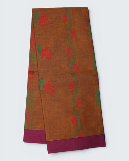 Bhavana Handlooms rust orange Coimbatore handloom saree featuring traditional bird motifs and a magenta woven border.