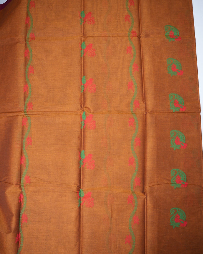 Bhavana Handlooms rust orange Coimbatore handloom saree featuring traditional bird motifs and a magenta woven border.