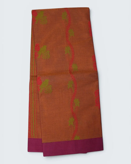 Bhavana Handlooms rust orange Coimbatore handloom saree with green bird motifs and a contrast magenta woven border.