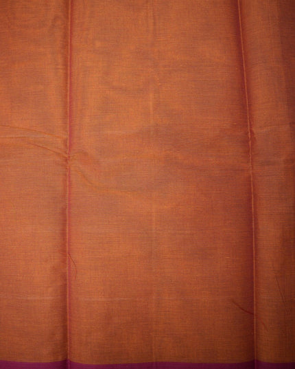 Bhavana Handlooms rust orange handloom saree with a contrasting magenta woven border and fine textured fabric