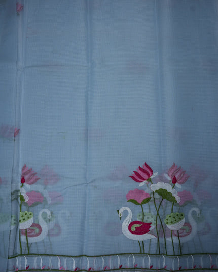 Bhavana Handlooms sky blue silk Kota saree featuring intricate swan and lotus embroidery and a delicate border.