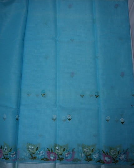 Bhavana Handlooms sky blue silk Kota saree featuring delicate floral embroidery motifs and a multicolor designer border.