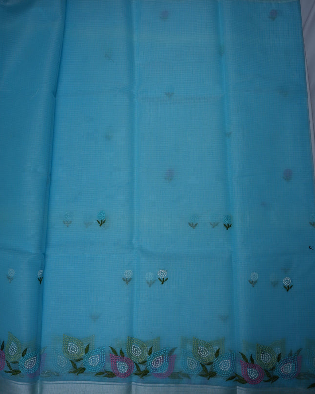 Bhavana Handlooms sky blue silk Kota saree featuring delicate floral embroidery motifs and a multicolor designer border.