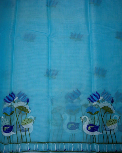 Bhavana Handlooms sky blue silk kota saree featuring intricate swan and lotus embroidery and a decorative border.