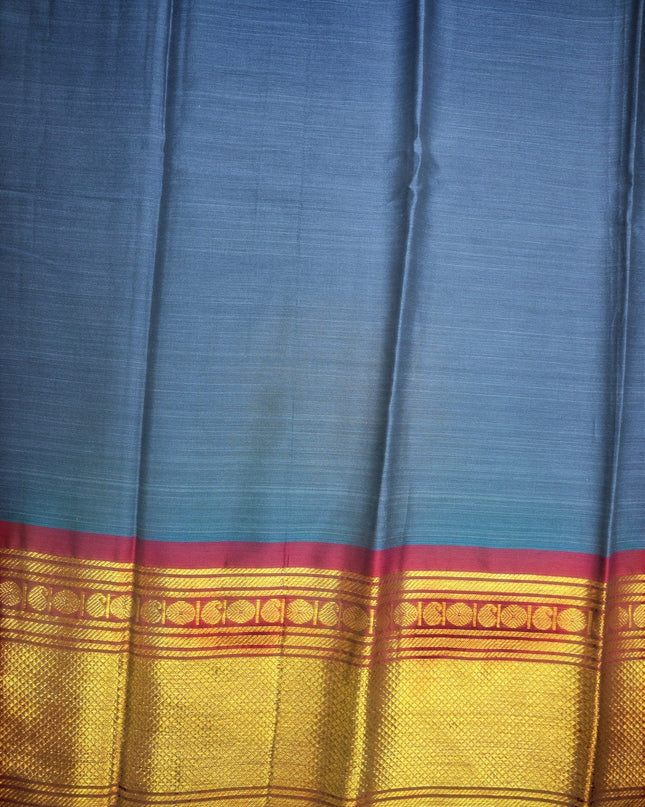 Bhavana Handlooms steel blue mercerized cotton saree with a rich zari border and soft finish.