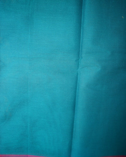 Bhavana Handlooms teal blue Coimbatore handloom saree featuring a contrast rani pink woven border