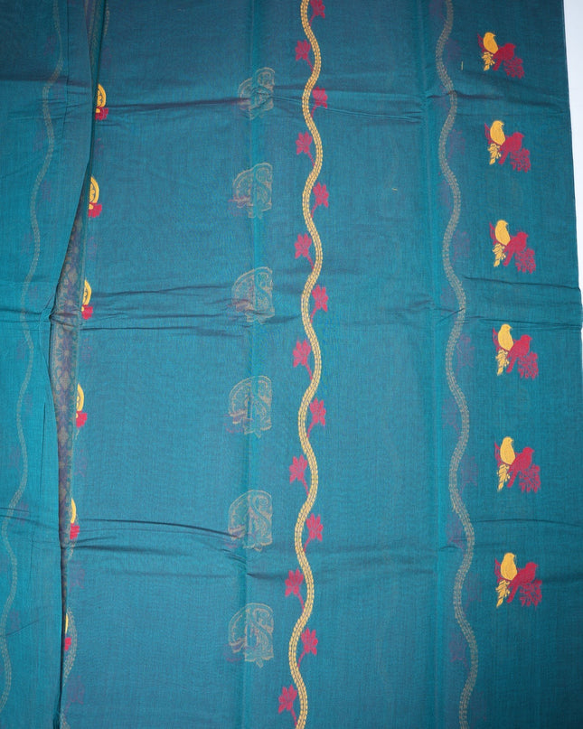 Bhavana Handlooms teal blue Coimbatore handloom saree featuring traditional bird motifs and a mustard woven border.