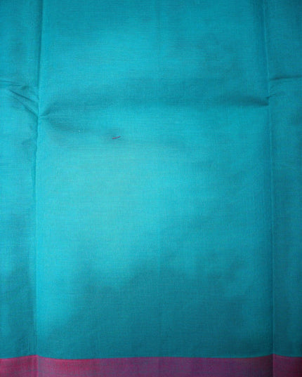 Bhavana Handlooms teal blue Coimbatore handloom saree featuring a contrasting pink woven border and bird motifs.