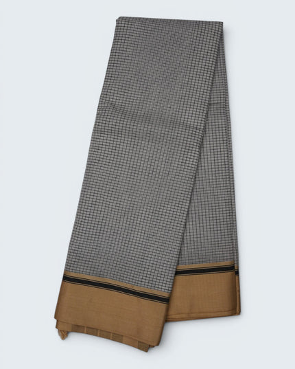 Bhavana Handlooms elegant white and black checkered mercerized cotton saree with a traditional gold and black border. Lightweight drape.