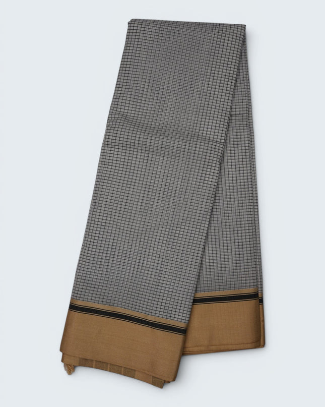 Bhavana Handlooms elegant white and black checkered mercerized cotton saree with a traditional gold and black border. Lightweight drape.