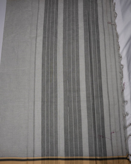 Bhavana Handlooms elegant white and black checkered Narayanapet mercerized cotton saree with a traditional border and soft finish.