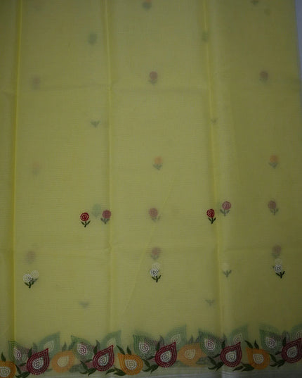 Bhavana Handlooms lemon yellow silk Kota saree featuring delicate floral embroidery motifs and a multicolor border.