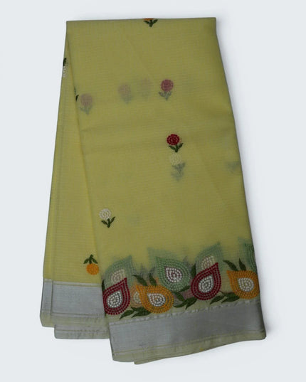 Bhavana Handlooms lemon yellow silk Kota saree featuring delicate floral embroidery and a multicolor designer border.